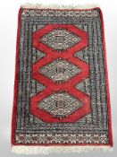 A Lahore Bokhara rug 100 cm x 62 cm