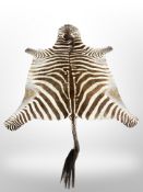 A zebra skin rug,