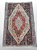 An Eastern needle work Kilim 107 cm x 73 cm