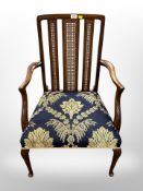 A cane backed armchair
