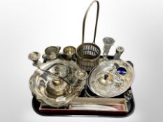 A group of silver plated wares, swing handled dish, two sconce candelabrum,