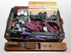 A box of Danish catalogues, rock climbing ropes, allan keys, bike pump,