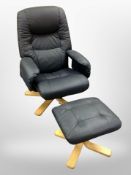 A black leather swivel armchair and matching footstool