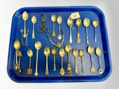 A collection of silver, silver plated and continental silver spoons, novelty tongs etc.