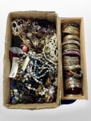 A box of costume jewellery, beaded necklaces,