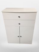 A contemporary white gloss chest,