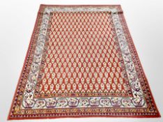 A machine made Persian design rug 200 cm x 136 cm