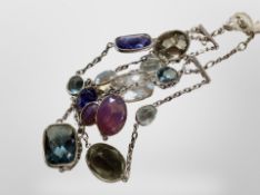 A triple strand Swarovski bracelet with various faceted crystals in differing colours