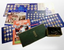 A vintage tin of dominoes and draughts counters together with folding board,