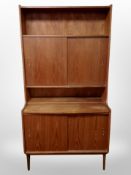 A 1970's Danish teak sliding door bookcase,