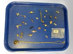 A gilt metal fob watch on chain (currently ticking), together with badges, brooches,