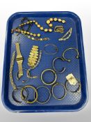 An antique gold plated bangle together with further cuff bangles, costume jewellery,