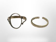 A 9ct gold band ring (broken), together with a 9ct gold ring with vacant collet.