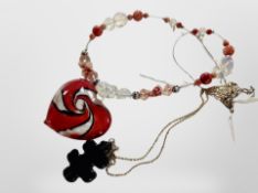 A Murano glass pendant on necklace of rolled glass beads and jigsaw piece necklace on silver chain