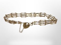 A 9ct yellow gold gate bracelet CONDITION REPORT: 3.