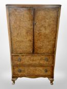 A figured walnut linen cabinet,