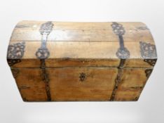 A 19th century oak and wrought iron bound domed topped chest,