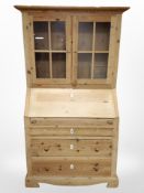 A late 19th century pine bureau bookcase,