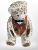A Royal Crown Derby teddy bear paperweight with silver stopper