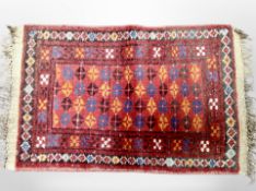 A small Afghan Balouch rug 77 cm x 44 cm