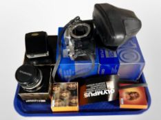 An Olympus OM10 camera body together with a further Olympus Zukio F=50mm lens, camera flash,