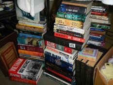 A large quantity of hard back and paper back books.