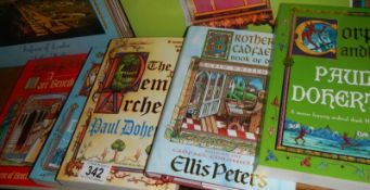 A quantity of paper back books.