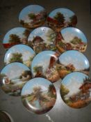 Eleven rural scene collector's plates.