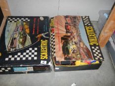 Two boxed Scalextric sets.