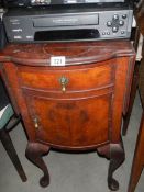 A bow front bedside cabinet with drop sides. COLLECT ONLY.