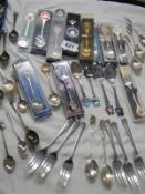 A good lot of collector's spoons.