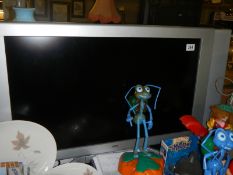 A Loewe television with controls. COLLECT ONLY.