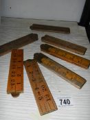 Seven vintage folding carpenter's rules.