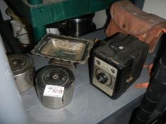 Two vintage Yorkshire penny banks and a Conway box camera.