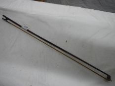 A violin bow stamped Vuillaume A Paris.