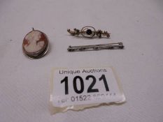 A Victorian gold brooch, cameo pendant in silver mount and a silver brooch.