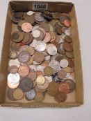 A mixed lot of UK and foreign coins.