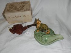 A Wade pipe stand and a cased pipe in the form of an elephant.