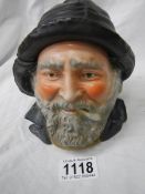 An early 20th century tobacco jar in the form of a fisherman's head.