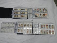 Four albums of assorted cigarette cards.