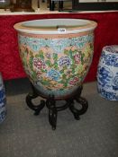 A large Chinese fish bowl on stand. COLLECT ONLY.