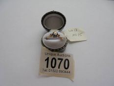 A diamond sapphire ring with eight sapphires surrounding a diamond to centre, hall marked 9ct,