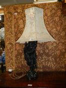 A Chinese figural table lamp. COLLECT ONLY.