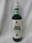 A bottle of Black & White Old Scotch Whisky,.