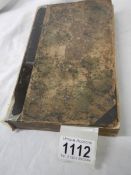 An antique book entitled 'The Practice of Piety.'