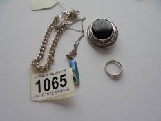 A silver kerb link bracelet, silver brooch, silver pendant, silver ring and silver charm.