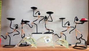 A quantity of candlesticks & 3 clear glass dolphins