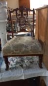 An Edwardian mahogany lyre back nursing chair