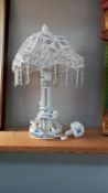 A glass & metal decorative table lamp