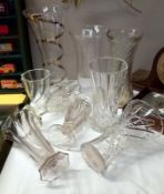 A quantity of cut & moulded glass vases